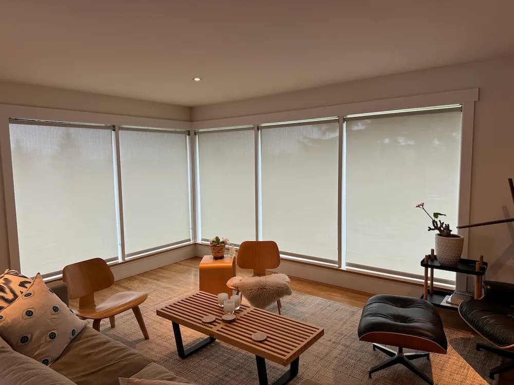 Roller shades installation in a living room